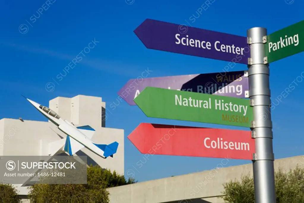 Low angle view of directional signs, Exposition Park, University Park, Los Angeles, California, USA