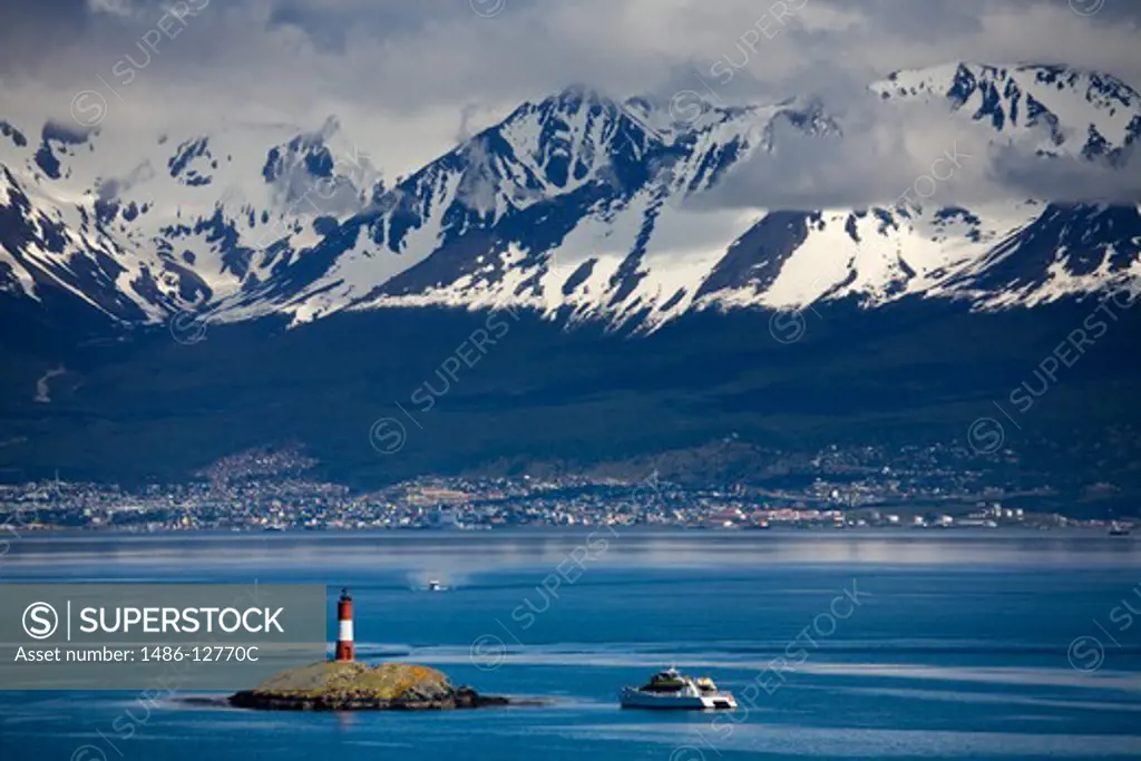 Lighthouse with snowcapped mountains in the background, Les Eclaireurs Lighthouse, Martial Mountains, Beagle Channel, Tierra Del Fuego, Patagonia, Argentina