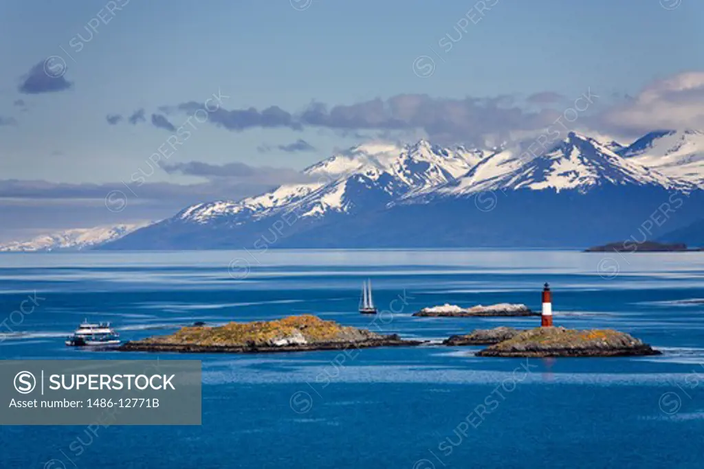 Lighthouse with snowcapped mountains in the background, Les Eclaireurs Lighthouse, Martial Mountains, Beagle Channel, Tierra Del Fuego, Patagonia, Argentina