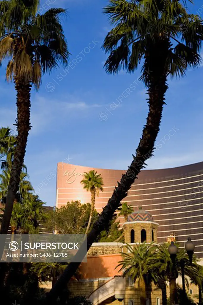 Palm trees in front of a hotel, Wynn Las Vegas, The Strip, Las Vegas, Nevada, USA