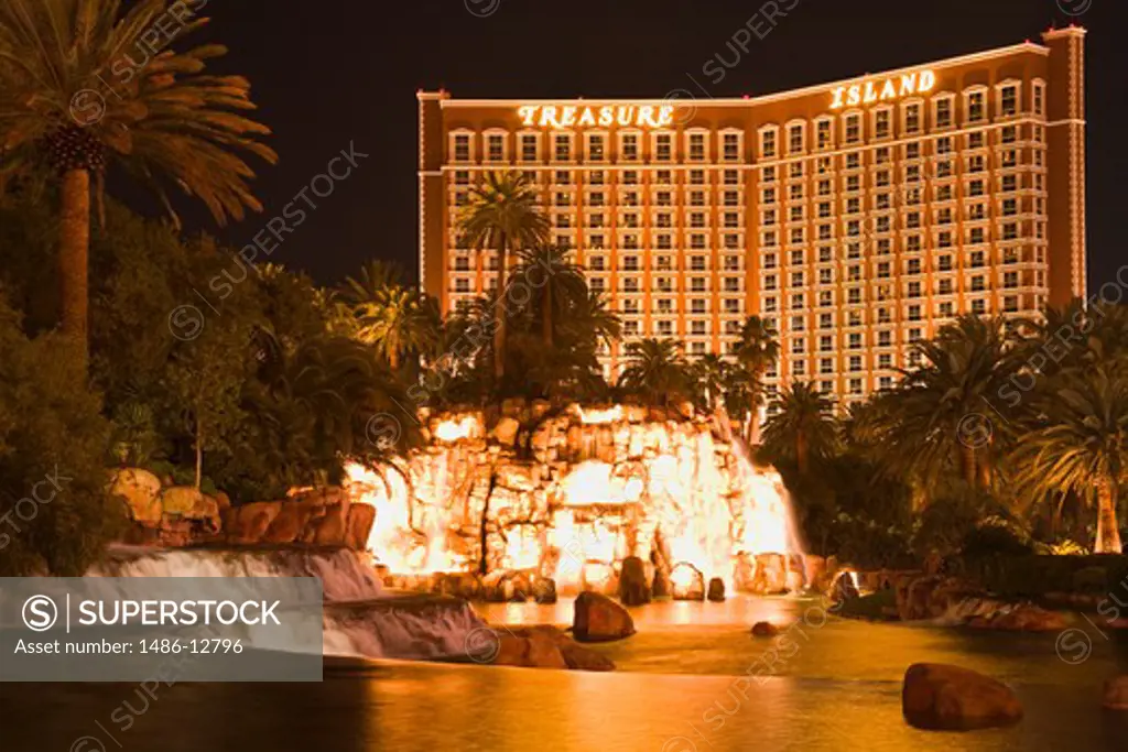 Hotel lit up at night, Treasure Island Hotel And Casino, The Strip, Las Vegas, Nevada, USA