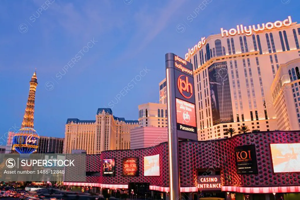 Shopping mall and a hotel lit up at dusk, Miracle Mile Shops, Planet Hollywood Resort And Casino, The Strip, Las Vegas, Nevada, USA