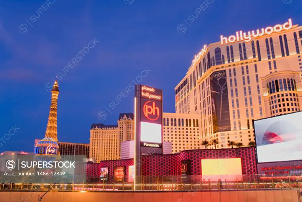 Shopping mall and hotels lit up at dusk, Miracle Mile Shops, Planet Hollywood Resort And Casino, Paris Las Vegas, The Strip, Las Vegas, Nevada, USA