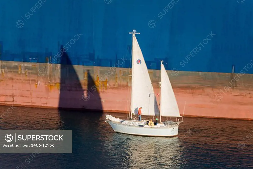 Yacht passing a ship, San Pedro, Los Angeles, California, USA