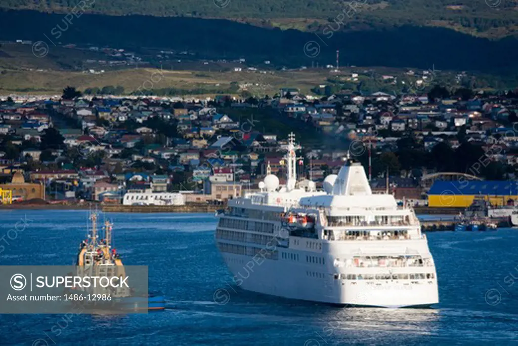 Cruise ship with a city in the background, Punta Arenas, Magallanes Province, Patagonia, Chile
