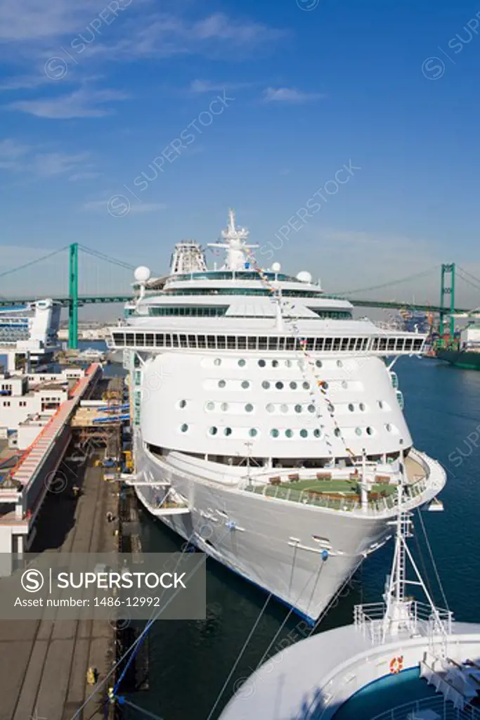 Royal Caribbean cruise ship at the port with a bridge in the background, Vincent Thomas Bridge, San Pedro, Los Angeles, California, USA