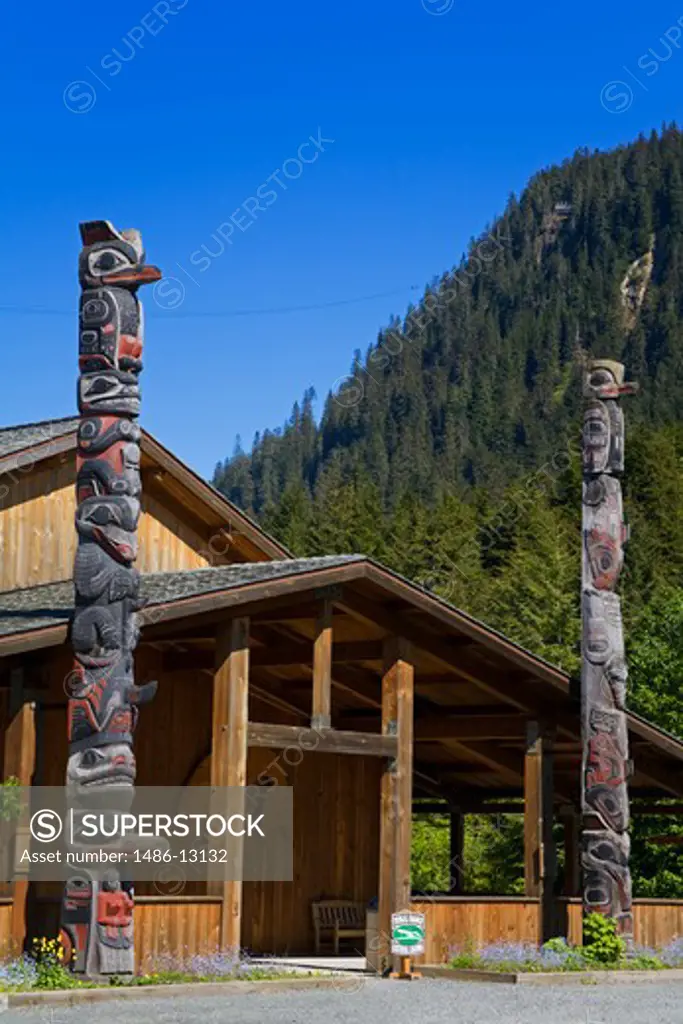 Totem poles in front of a museum, Icy Strait Point, Hoonah City, Chichagof Island, Alaska, USA
