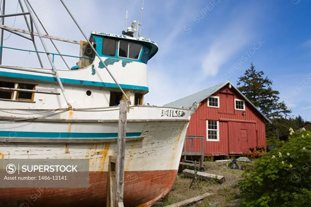 Fishing boat with a museum in the background, Cannery Museum, Icy Strait Point, Hoonah City, Chichagof Island, Alaska, USA