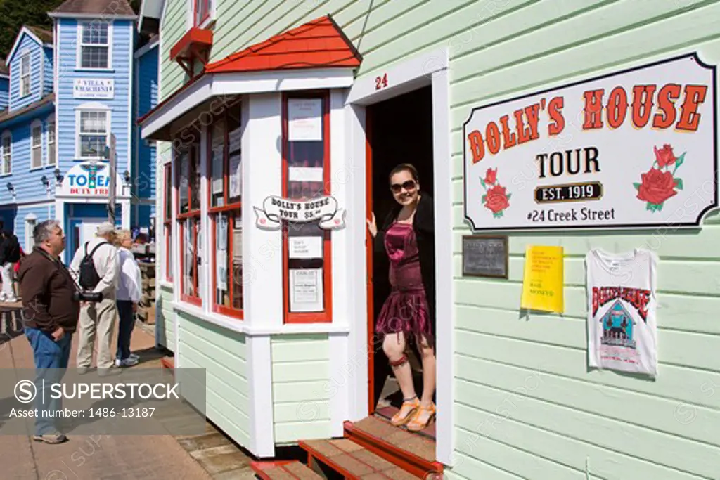 Prostitute standing at the entrance of a brothel, Dolly's House, Creek Street, Ketchikan, Alaska, USA