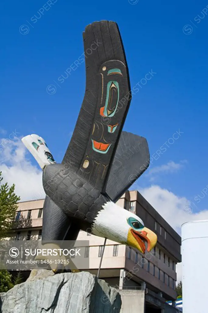 Low angle view of a totem pole, Thundering Wings Eagle, Eagle Park, Ketchikan, Alaska, USA