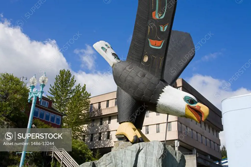 Low angle view of a totem pole, Thundering Wings Eagle, Eagle Park, Ketchikan, Alaska, USA