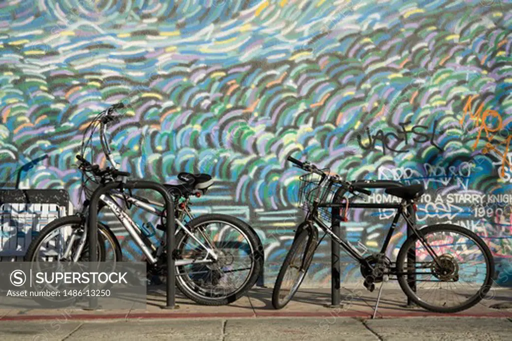 Bicycles parked at the roadside, Venice Beach, City of Los Angeles, California, USA