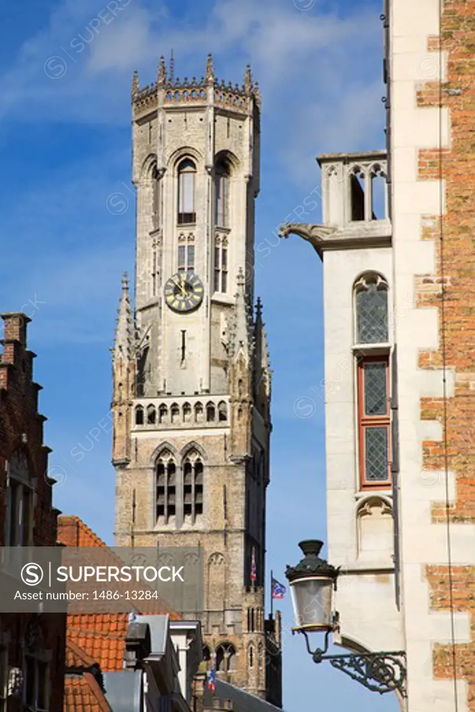 Low angle view of a bell tower in a city, Bruges, Belgium
