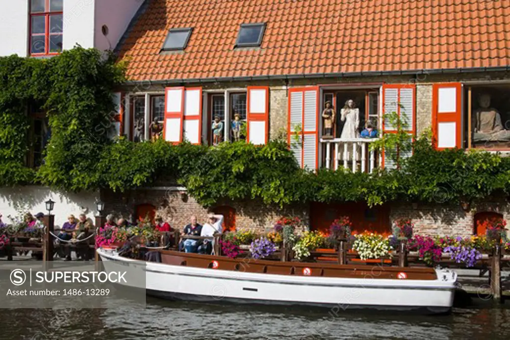 Tourboat in a canal, Bruges, Belgium