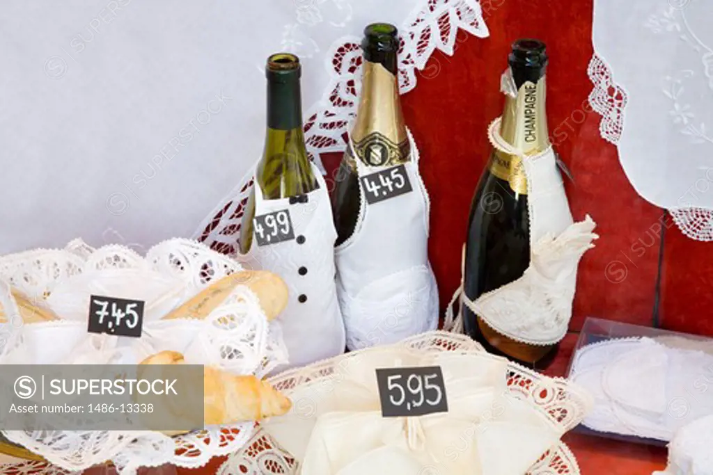 Champagne bottles with lace products for display in a store, Bruges, Belgium