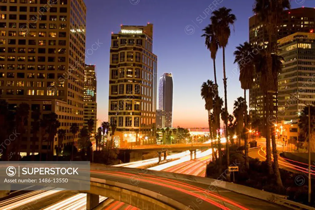 City lit up at dusk, Wedbush Tower, Ritz-Carlton Hotel, California State Route 110, Los Angeles, California, USA
