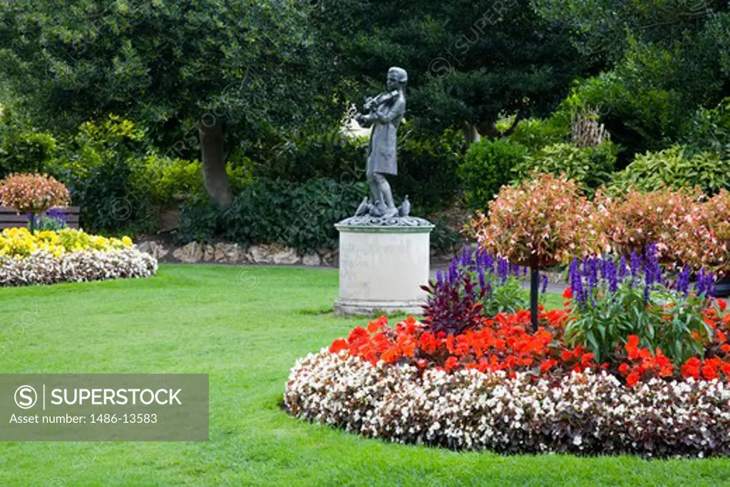 Statue of Mozart in a garden, Parade Gardens, Bath, Somerset, England