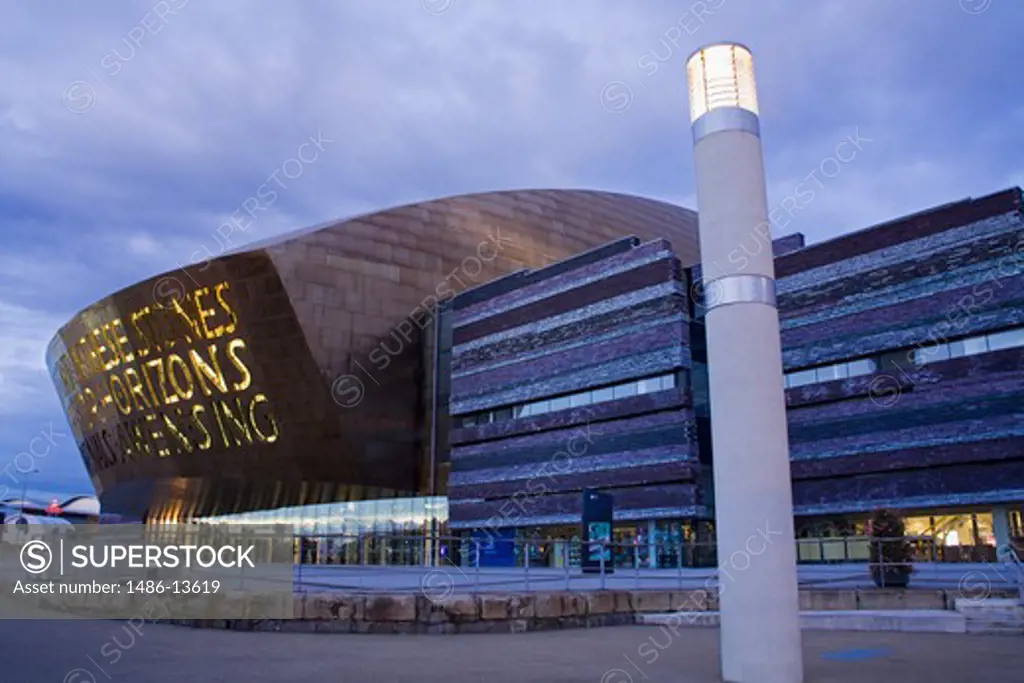 Building lit up at dusk, Wales Millennium Centre, Cardiff Bay, Cardiff, Wales