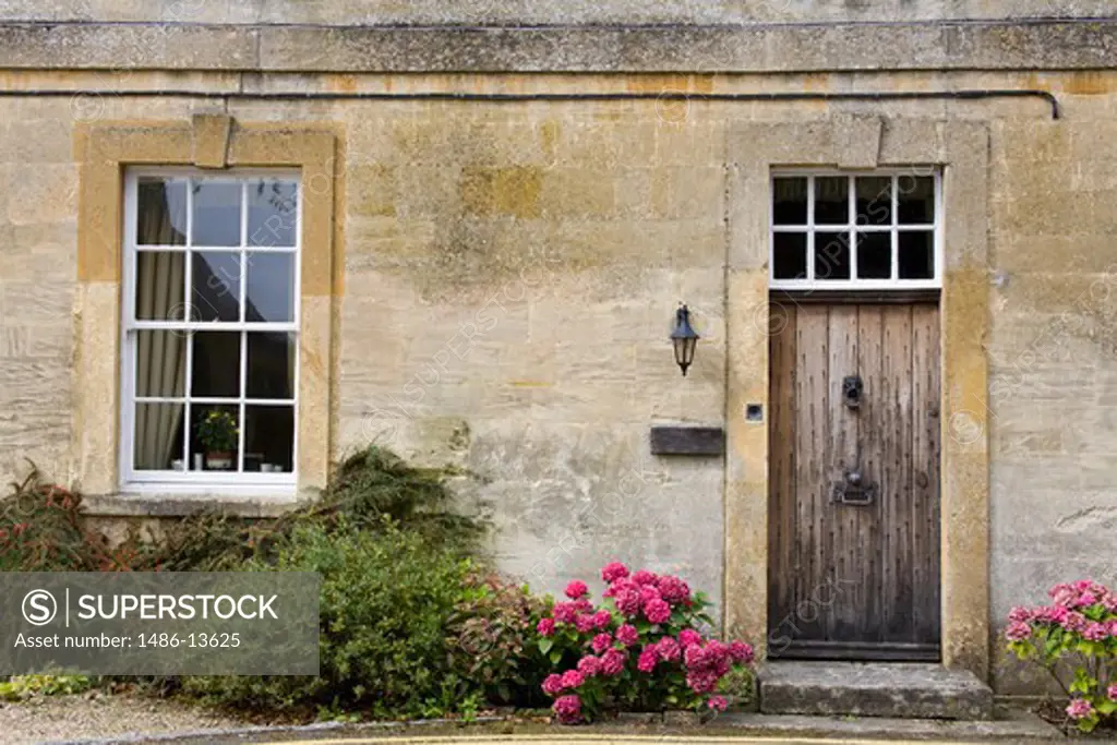Flowers and plants outside a house, Bourton-On-The-Water, Cotswold, Gloucestershire, England