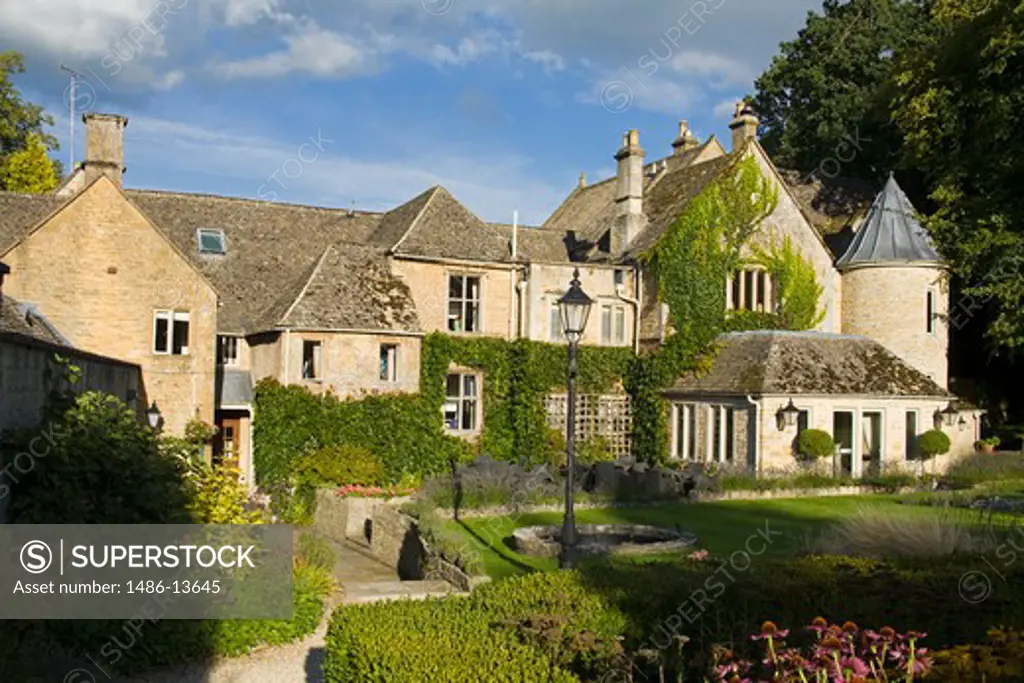 Garden in front of a hotel, Lords of the Manor Hotel, Upper Slaughter, Gloucestershire, England