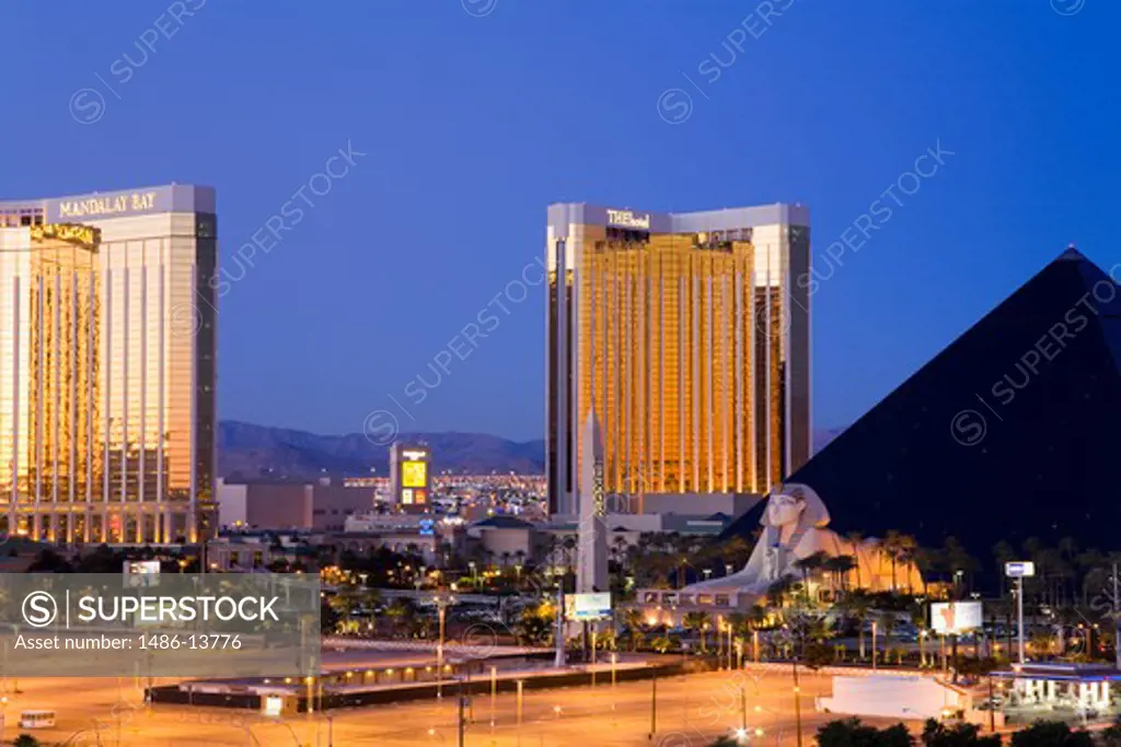 Hotels in a city at dawn, Mandalay Bay Resort And Casino, Luxor Las Vegas, Las Vegas, Nevada, USA