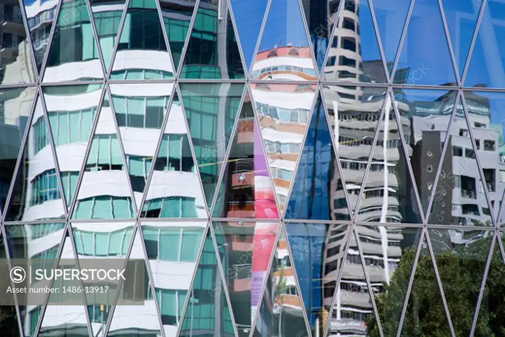 Reflections on a modern glass building, NZ Center, Central Business District, Auckland, North Island, New Zealand