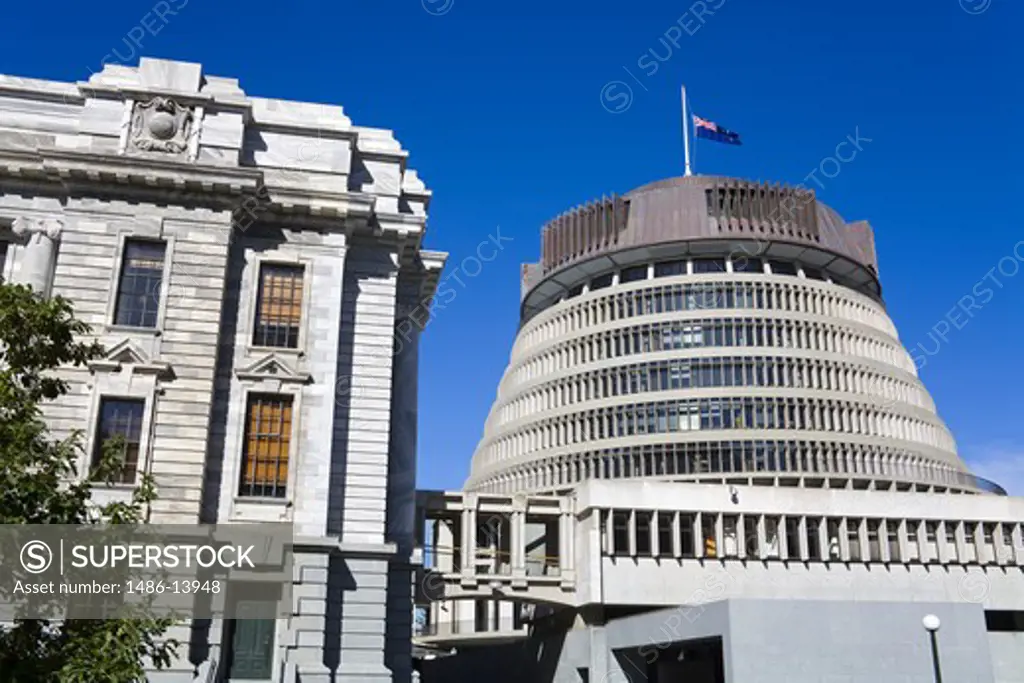 Low angle view of Beehive and Parliament Building, Wellington, North Island, New Zealand