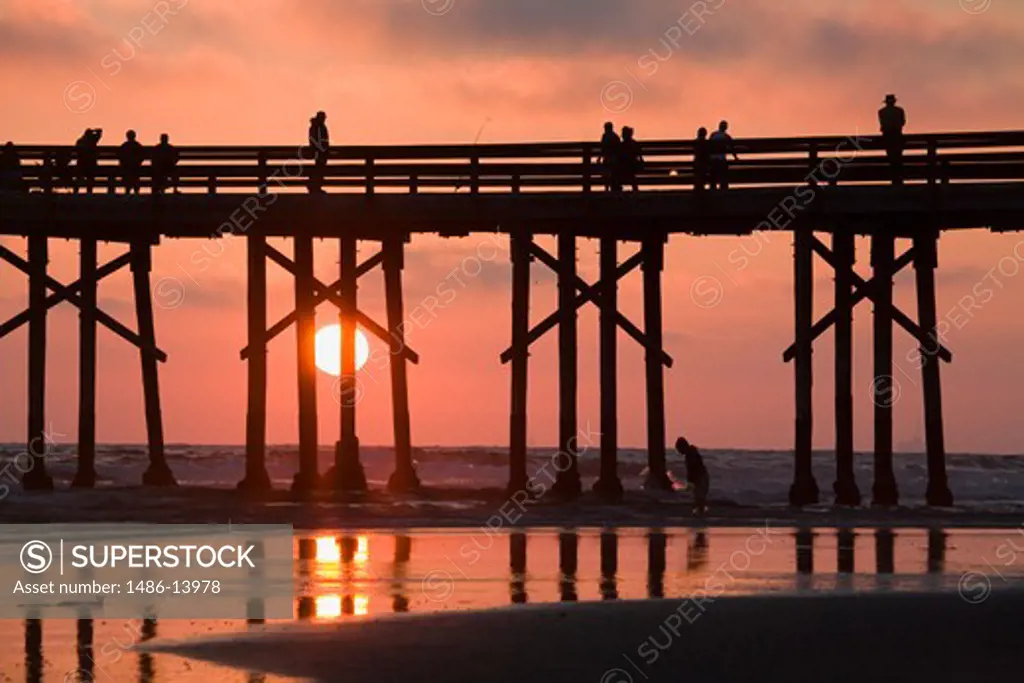 Silhouette of people on a pier, Newport Beach, Orange County, California, USA