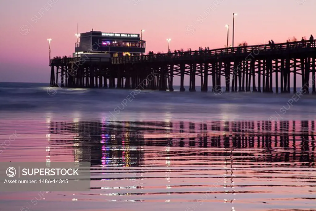 USA, California, Orange County, Newport Beach, Pier at sunset