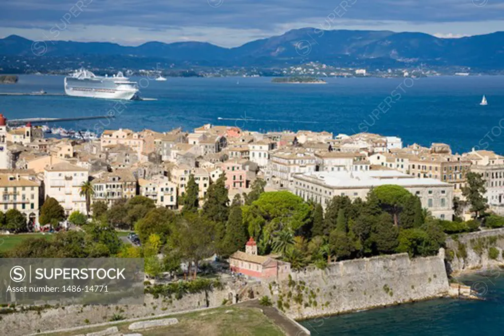 High angle view of a town with cruise ship in the background, Corfu Town, Ionian Islands, Greece