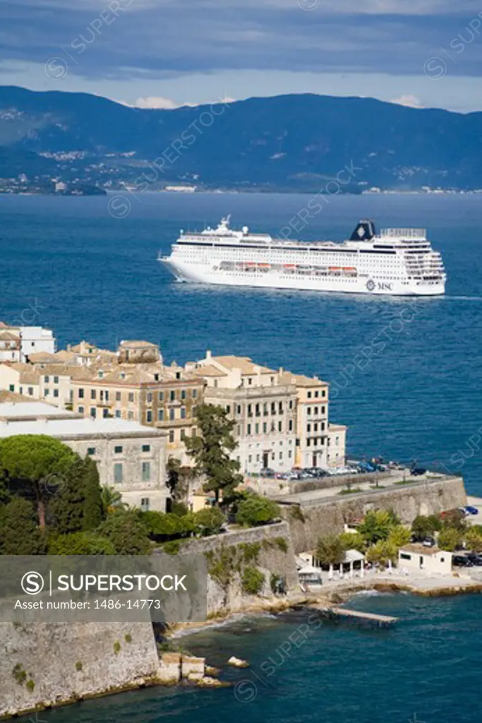 High angle view of a town with cruise ship in the background, Corfu Town, Ionian Islands, Greece