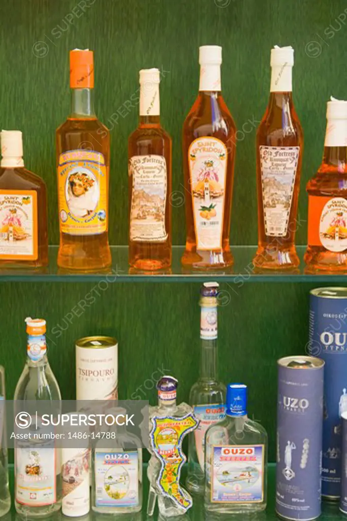 Kumquat liqueur bottles in a store, Corfu Town, Ionian Islands, Greece