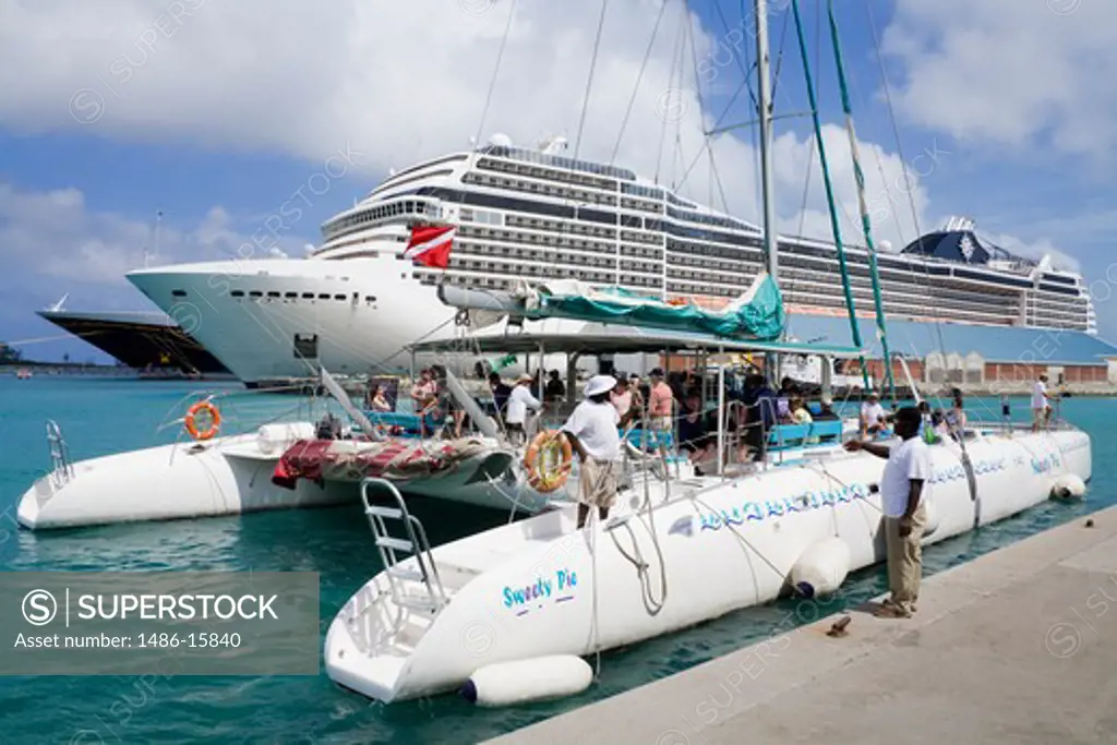 Catamaran and a cruise ship at a harbor in Nassau, New Providence Island, Bahamas