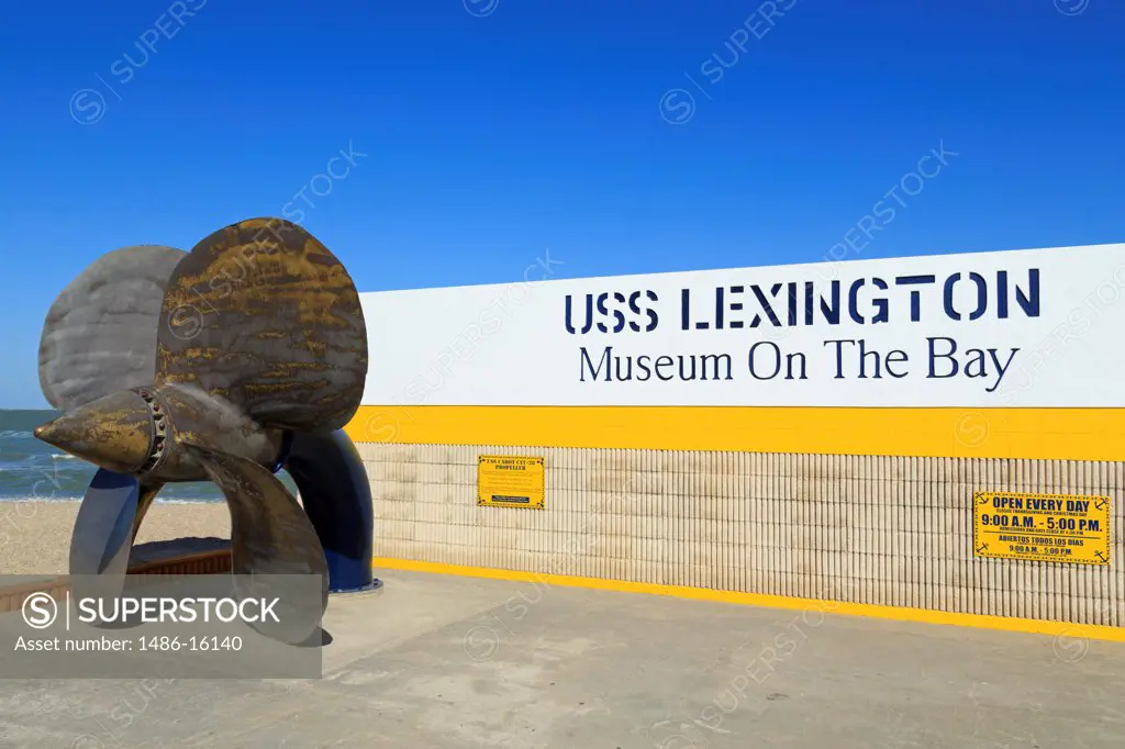 Sculpture of an anchor near the signboard of a museum, USS Lexington Museum, North Beach, Corpus Christi, Texas, USA