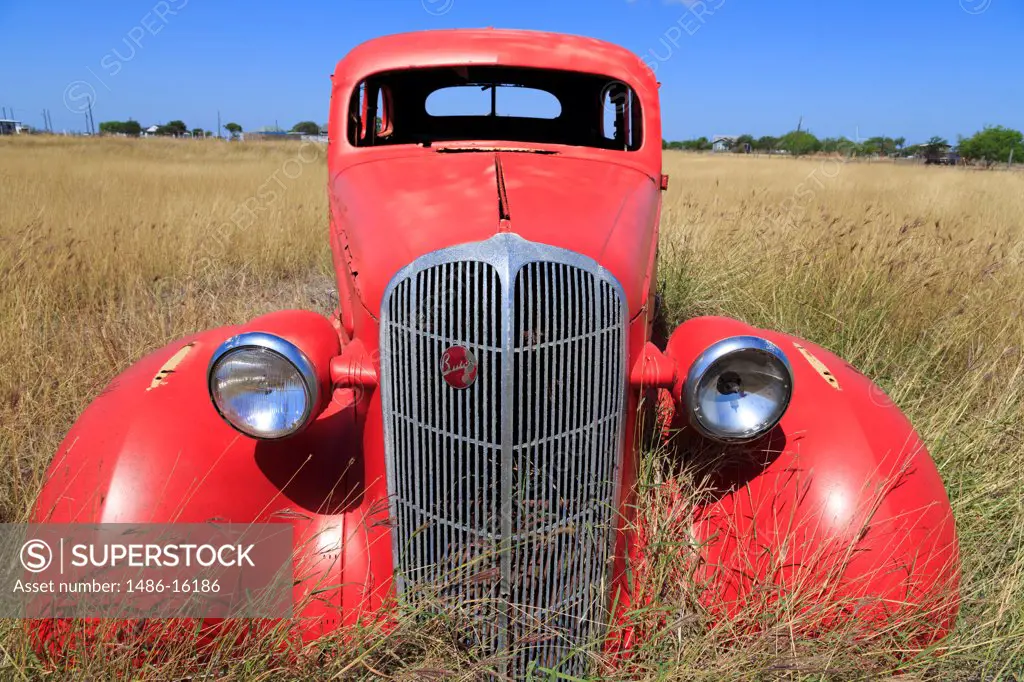 Abandoned car in field, Corpus Christi, Texas, USA