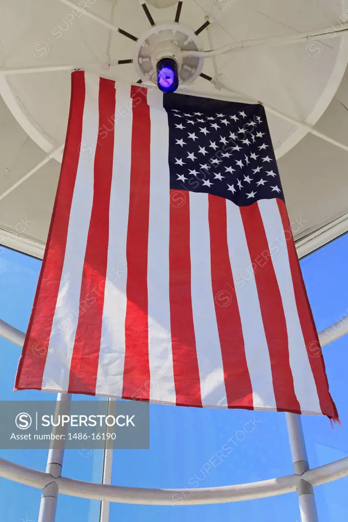 American flag hanging under a lantern in a lighthouse, Point Isabel Lighthouse, Port Isabel, Texas, USA