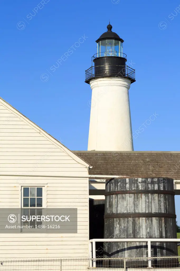 Building with a lighthouse in the background, Point Isabel Lighthouse, Port Isabel, Texas, USA