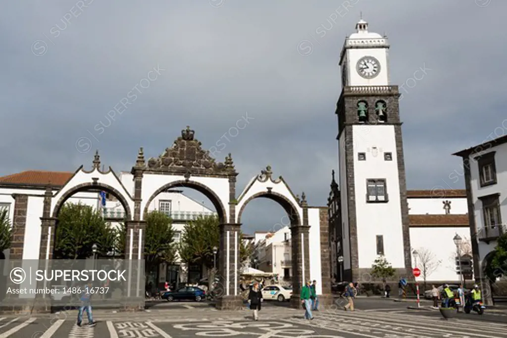 City gates with clock tower of St. Sebastian Church at Ponta Delgada, Sao Miguel, Azores, Portugal