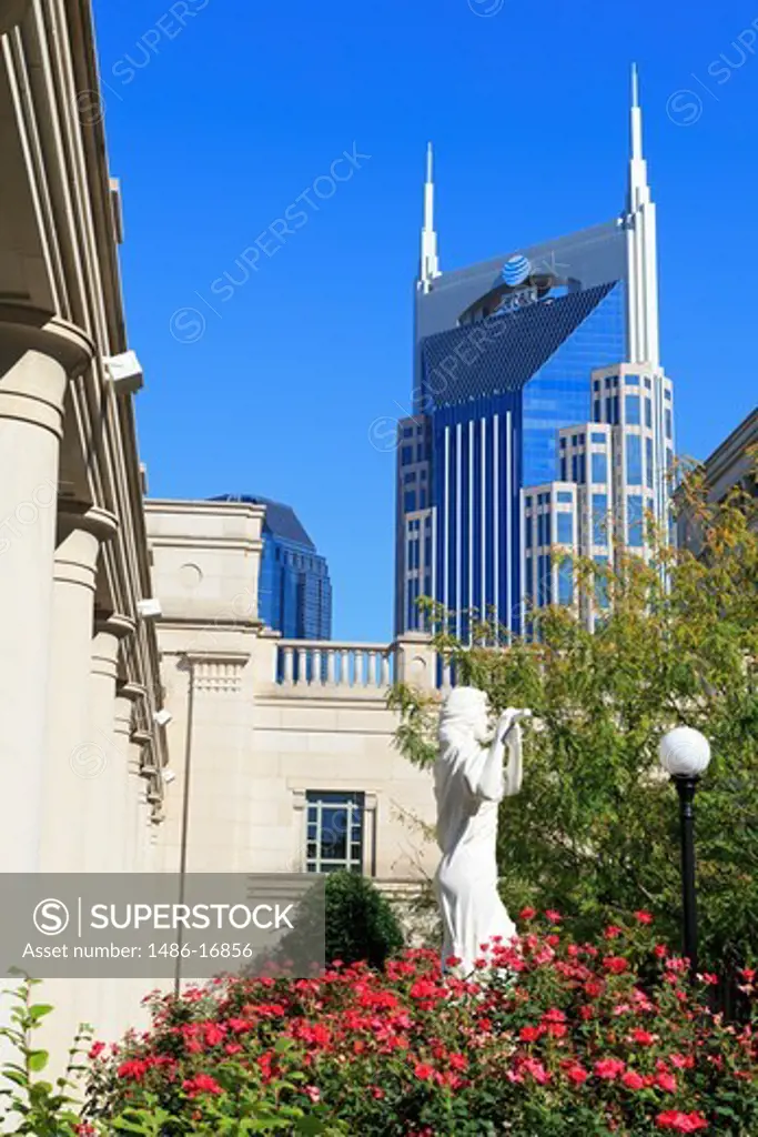 Statue at Schermerhorn Symphony Center with AT&T Building in the background, Nashville, Tennessee, USA