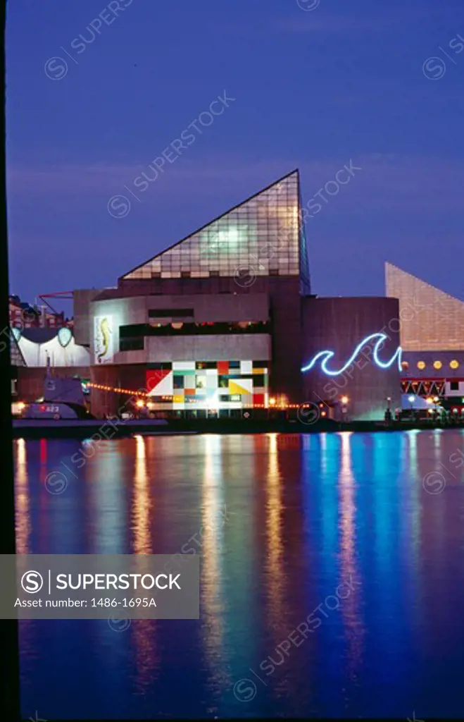 USA, Maryland, Baltimore, National Aquarium illuminated at dusk