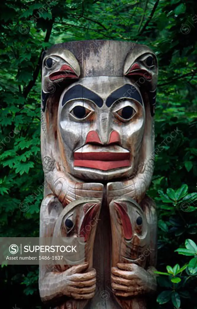 Totem pole in a forest, Capilano Suspension Bridge Park, Vancouver, British Columbia, Canada
