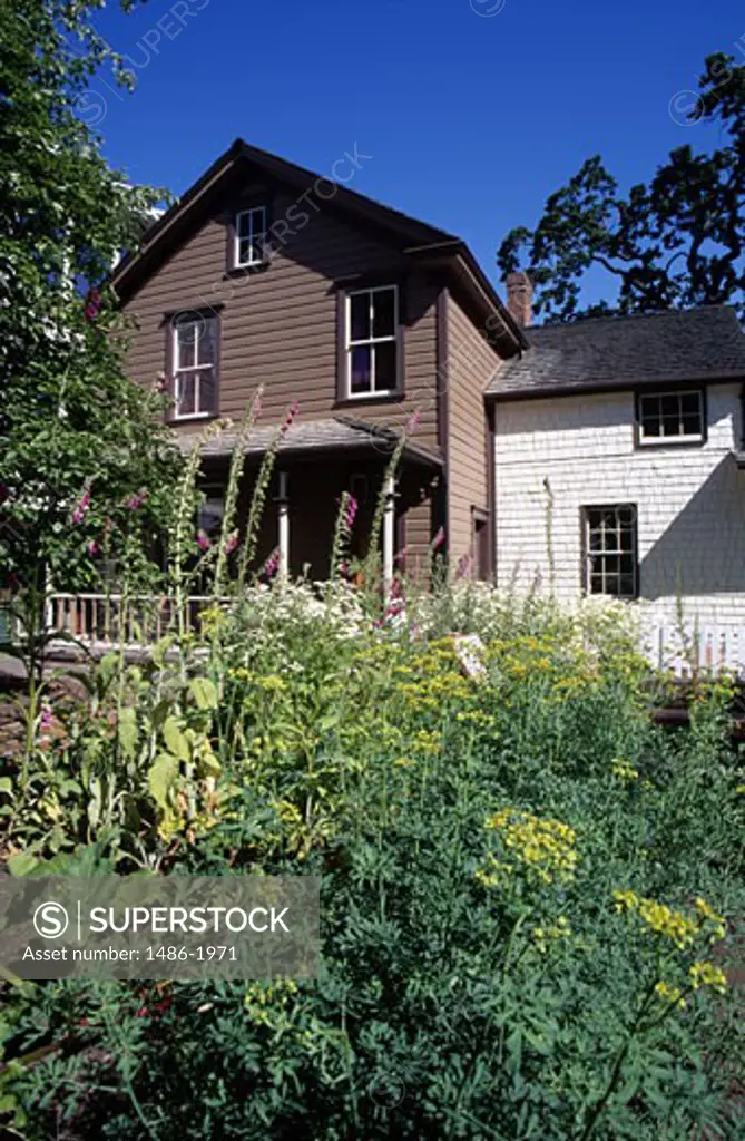 Canada, British Columbia, Victoria, Helmcken House, facade with flowers on the foreground