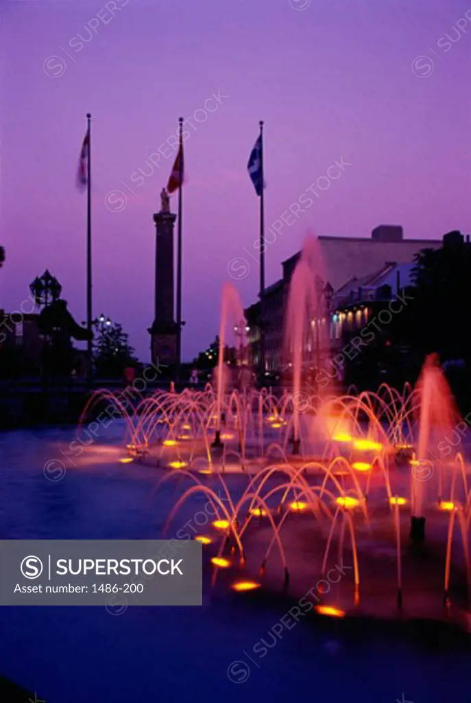 Place Vauquelin Fountains lit up at night, City Hall, Montreal, Quebec, Canada