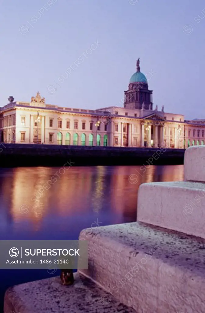 Facade of a government building along the river at dusk, Custom House, Dublin, Ireland