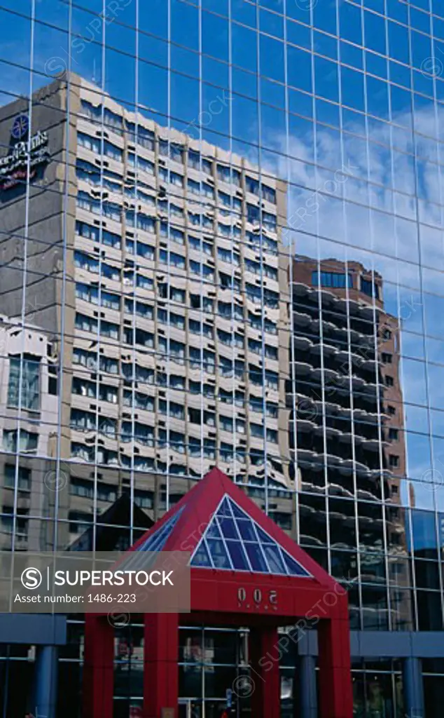 Reflection of buildings on the window glass of another building, Montreal, Quebec, Canada