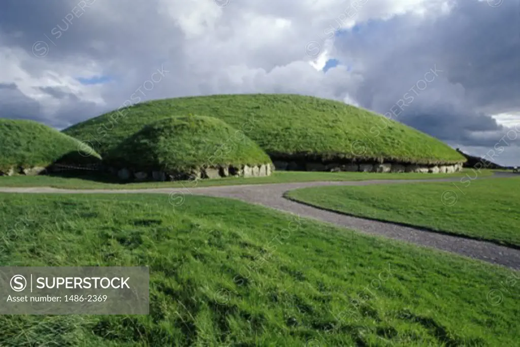 Clouds over the ancient tombs, Megalithic Passage Tombs, Knowth, Boyne Valley, Ireland