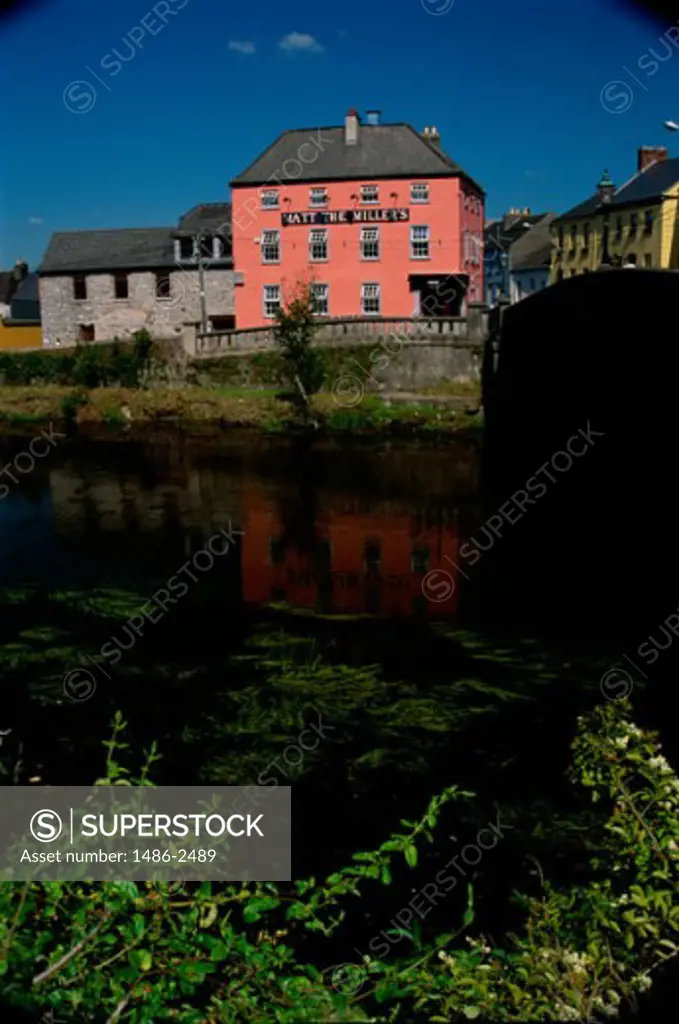 Buildings along a river, River Nore, Kilkenny, Ireland