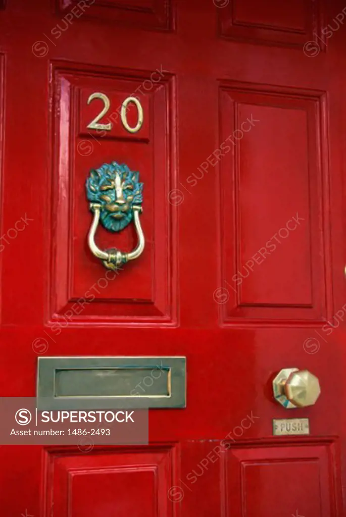 Red door with a brass mail slot and a door knocker, Merrion Square, Dublin, Ireland