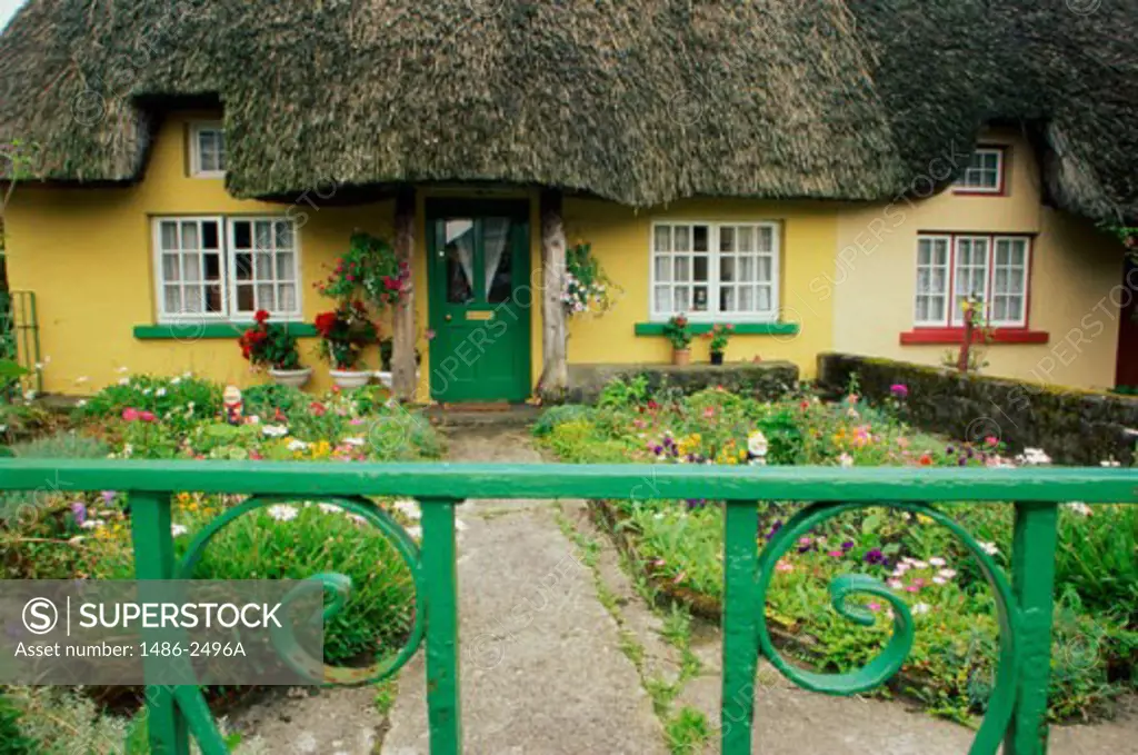 Facade of a thatched roof house, Adare, County Limerick, Ireland