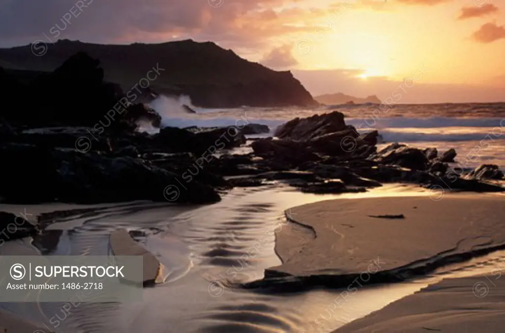 Rocks on the beach at sunset, Clogher Head Beach, Dingle Peninsula, County Kerry, Ireland